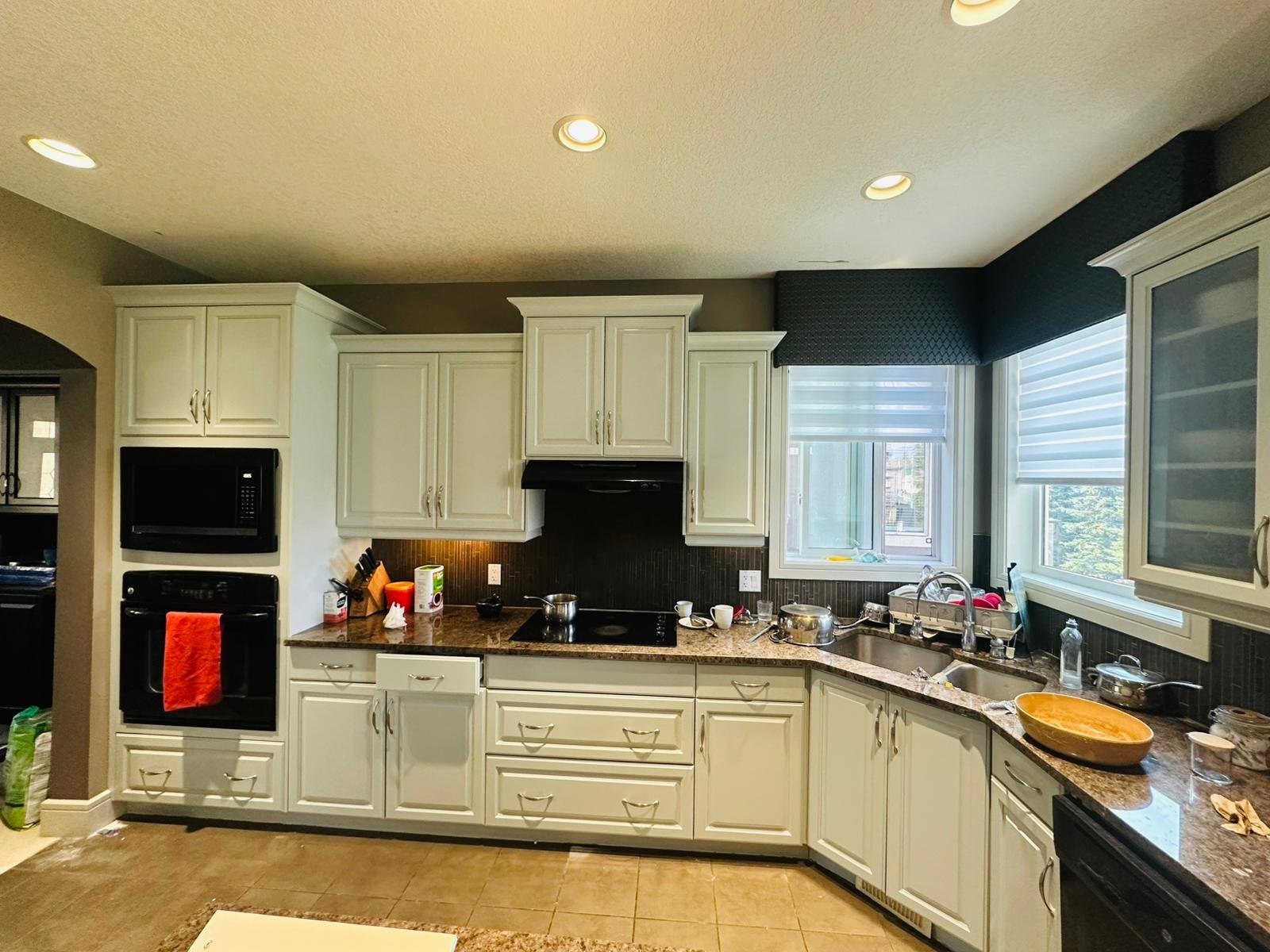 Before and after kitchen cabinet painting in Calgary